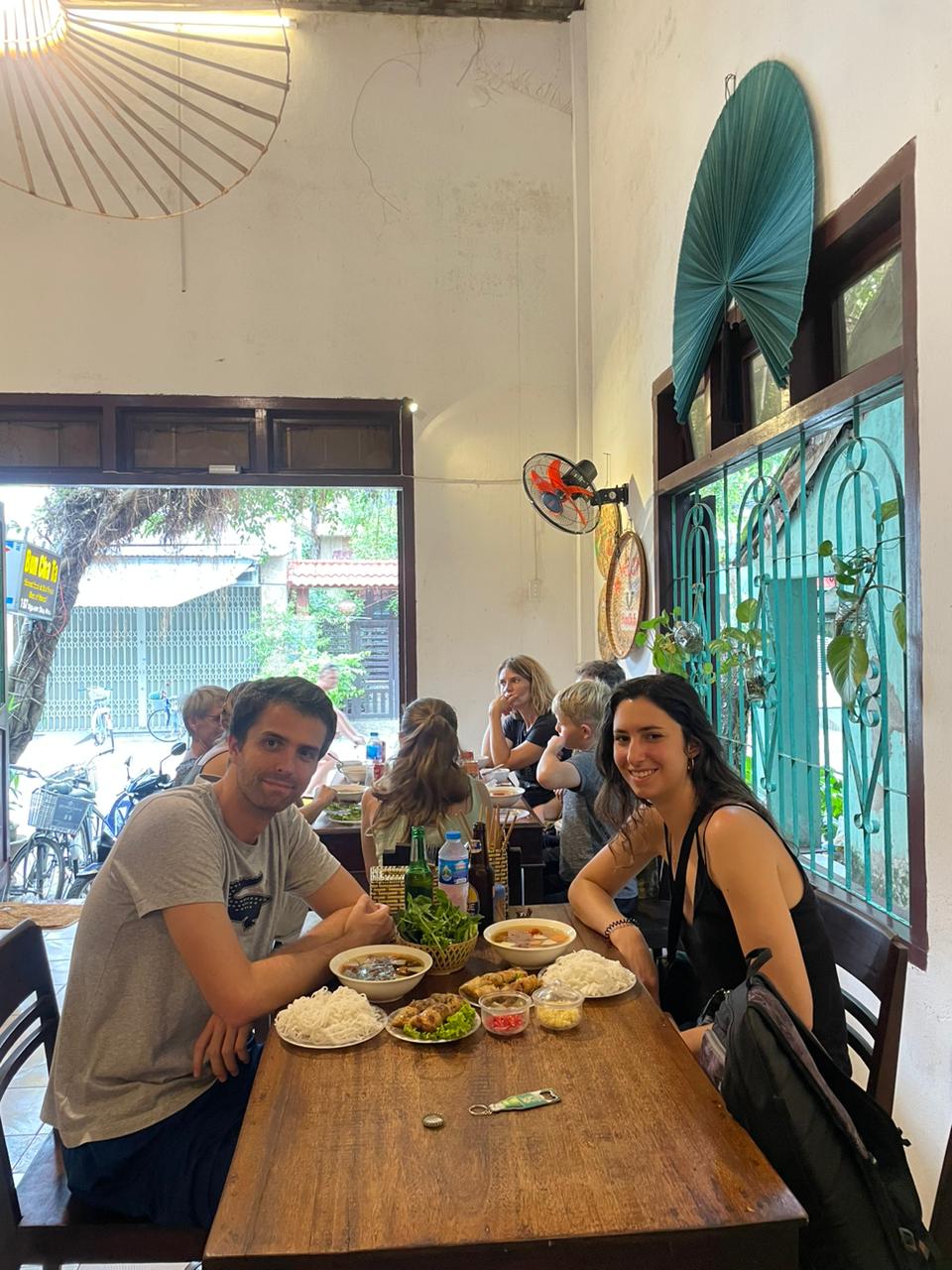 Couple enjoying Bun Cha at a local eatery in Hoi An